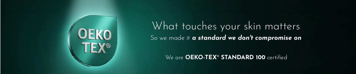 A dark teal promotional banner featuring the OEKO-TEX certification logo on the left and white text on the right that reads, 'What touches your skin matters. So we made it a standard we don't compromise on.